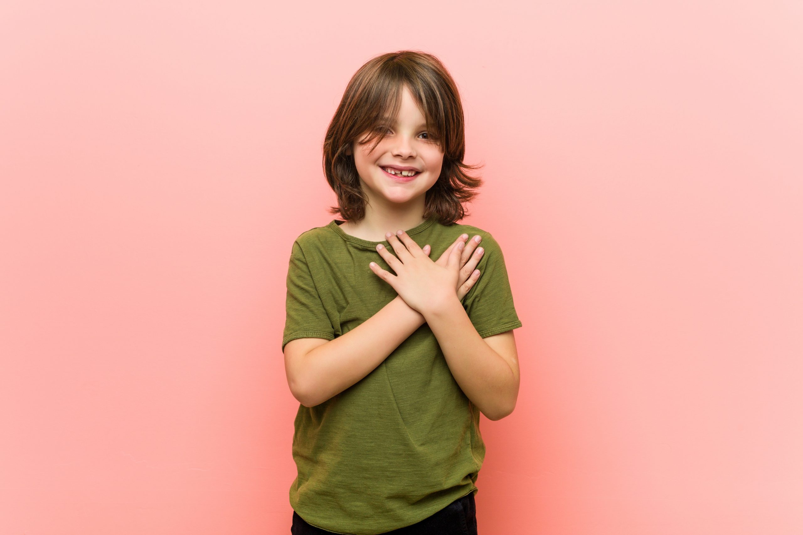 little-boy-has-friendly-expression-pressing-palm-chest-love (1)
